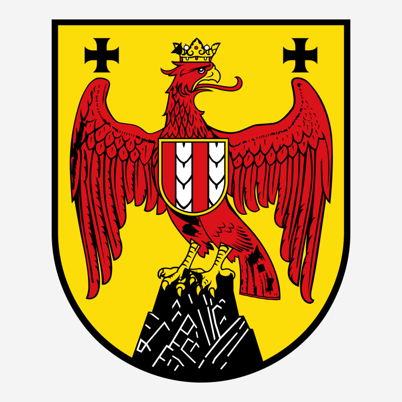 Wappen des Burgenlands: roter Adler mit Krone auf goldenem Grund, auf der Brust ein rot-weiß-roter Schild