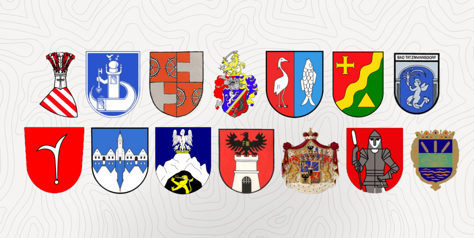 Eine Auswahl burgenländischer Gemeindewappen in zwei Reihen nebeneinander